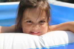 Young girl enjoying a swimming pool